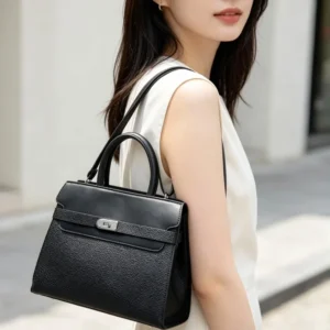 Bolso tipo Kelly negro, asa corta + correa bandolera