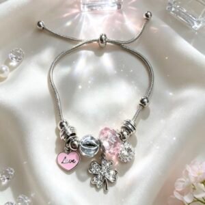 PULSERA PLATEADA CON DIJER DE TREBOL DE CUATRO HOJAS Y CRISTAL CORAZON ROSA GGL-0001