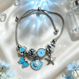 PULSERA PLATEADA CON DIJES DE CONCHA CON PERLA Y ESTRELLA DE MAR MARIPOSA AZUL GGL-0001