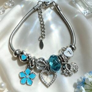 PULSERA PLATEADA CON DIJER DE CORAZON HUECO ELEFANTE CON BRILLANTE FLOR TURQUESA GGL-0002