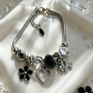 PULSERA PLATEADA CON DIJER DE CORAZON HUECO ELEFANTE CON BRILLANTE FLOR NEGRO GGL-0002