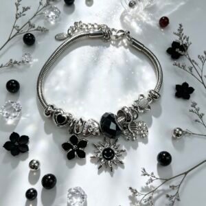 PULSERA PLATEADA CON DIJER DE ELEFANTE SOL SONRIENTE FLOR NEGRO GGL-0002
