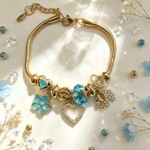 PULSERA DORADA CON DIJER DE CORAZON ELEFANTE FLOR TURQUESA GGL-0003
