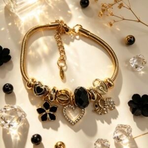 PULSERA DORADA CON DIJES DE CORAZON ELEFANTE FLOR NEGRA GGL-0003