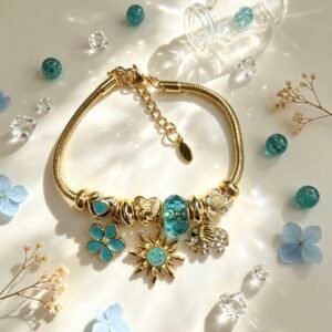 PULSERA DORADA CON DIJER DE SOL SONRIENTE ELEFANTE FLOR TURQUESA GGL-0003