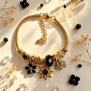 PULSERA DORADA CON DIJER DE SOL SONRIENTE ELEFANTE FLOR NEGRA GGL-0003