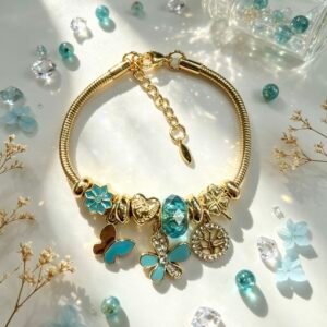 PULSERA DORADA CON DIJER DE ARBOL DE VIDA MARIPOSA FLOR TURQUESA GGL-0003