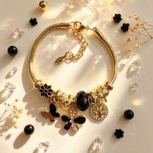 PULSERA DORADA CON DIJER DE ARBOL DE VIDA MARIPOSA FLOR NEGRA GGL-0003