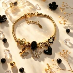 PULSERA DORADA CON DIJER DE MARIPOSA FLOR CON PIEDRAS CORAZON NEGRA GGL-0003
