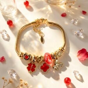PULSERA DORADA CON DIJER DE MARIPOSA TREBOL DE CUATRO HOJAS ROJO GGL-0003